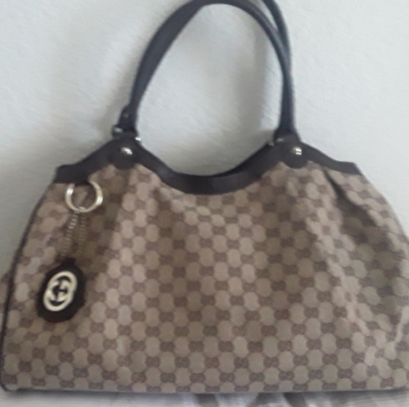 Gucci OS Sukey bag unused. Tan with brown Gucci emblems and gold hardware. - Picture 2 of 3